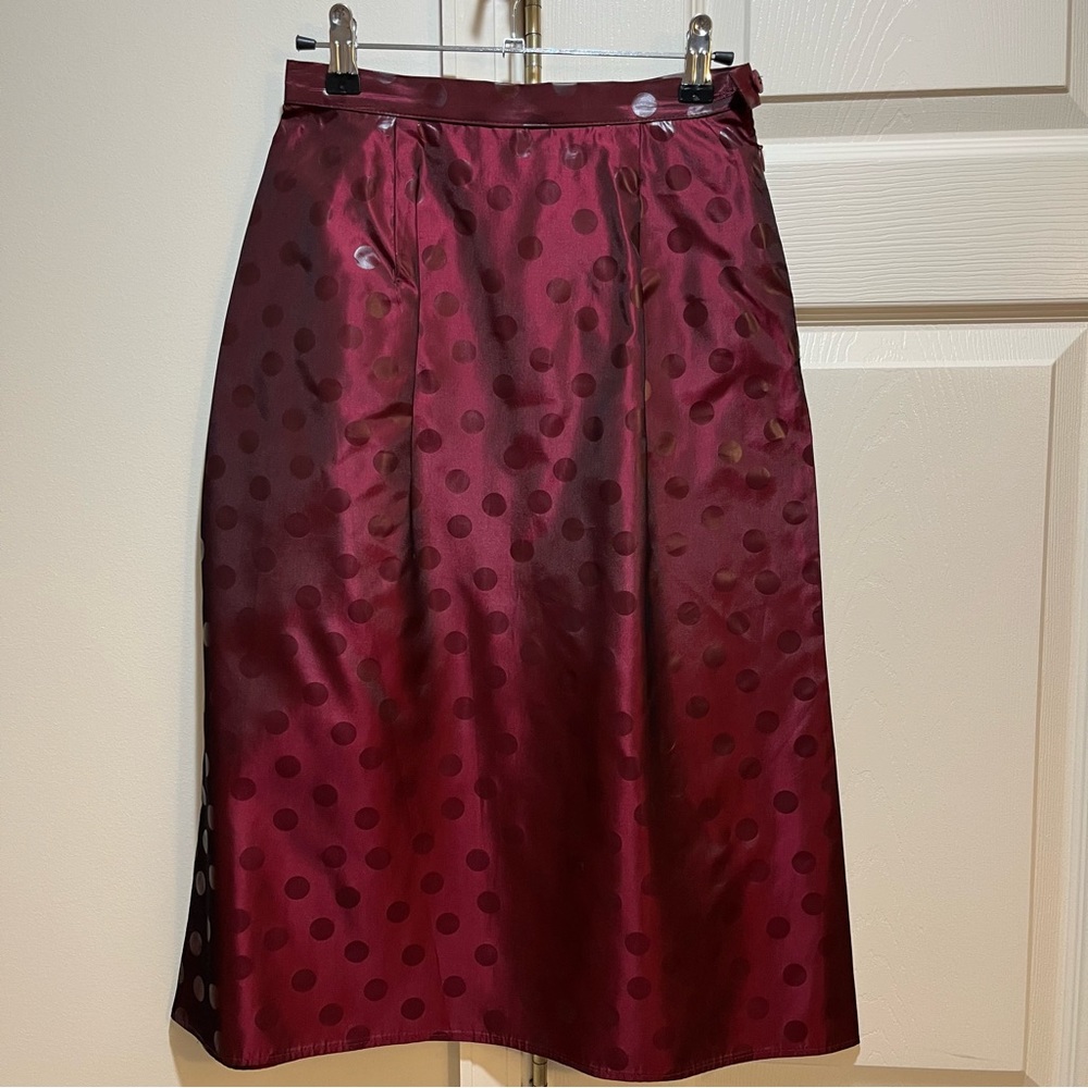 A Line Midi Skirt with shimmer fabric and monotone polka dot detail.